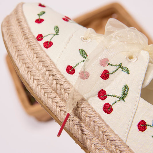 Up close detail image of the cherry embroidered Carolina lace-up espadrille