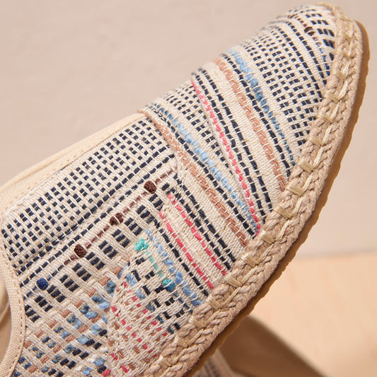 Up close detail image of the Palmer Plus with global stripes