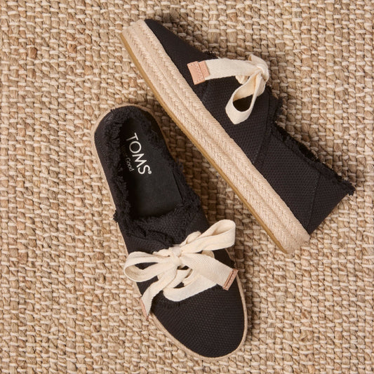 Laydown image of the black beachside woven lace up Carolina Espadrille