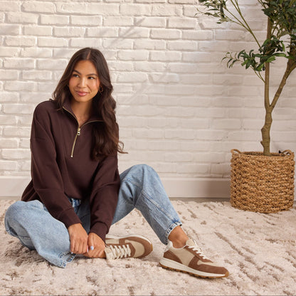 On model image of the TRVL LITE Retro Runner Sneaker in Water Repellent Brown Sugar