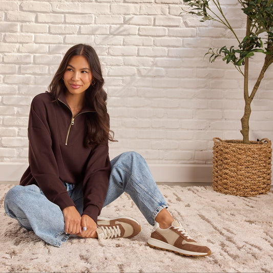 On model image of the TRVL LITE Retro Runner Sneaker in Water Repellent Brown Sugar