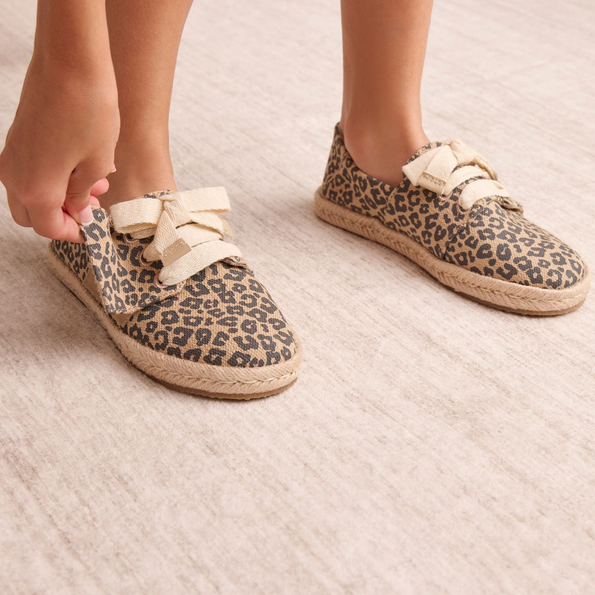 ON figure detail shot of the Kid's leopard Carolina lace up espadrille