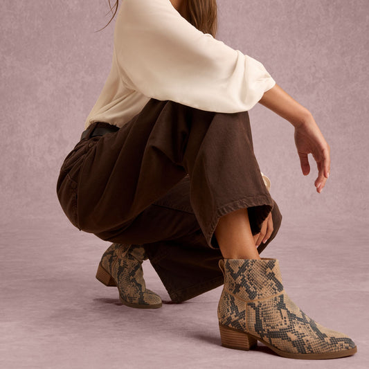 On model image of the Womens Elia Ankle Boot Taupe Snake Print Suede