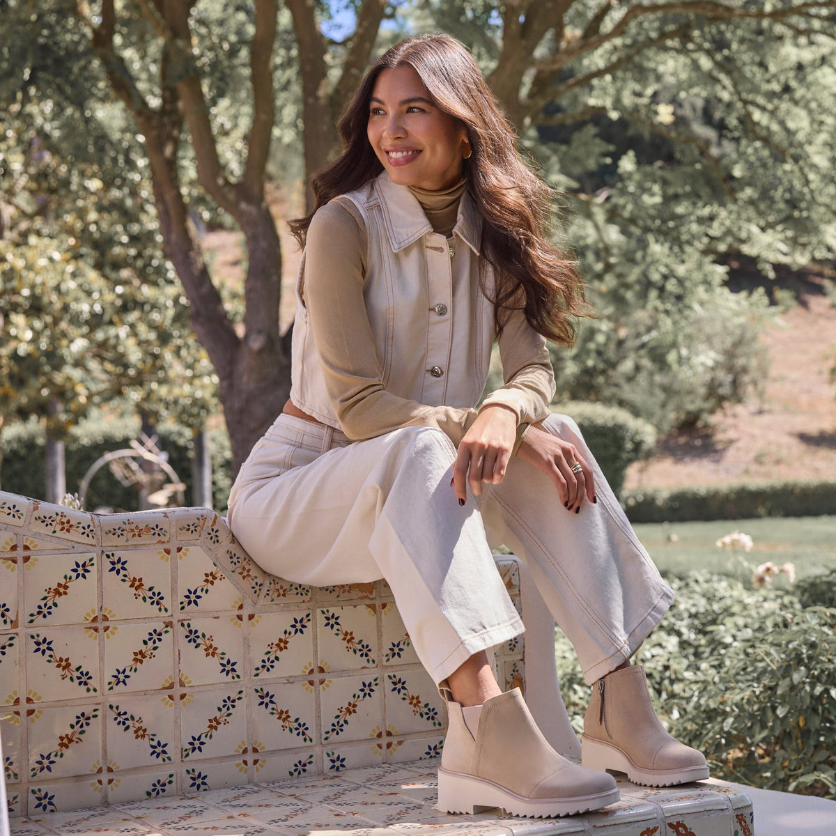 On figure image of the oatmeal suede Maude wedge bootie