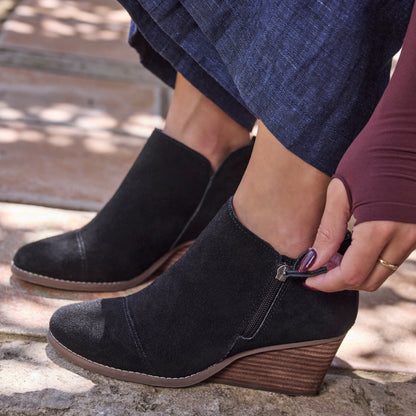 On figure image of the black suede Goldie bootie