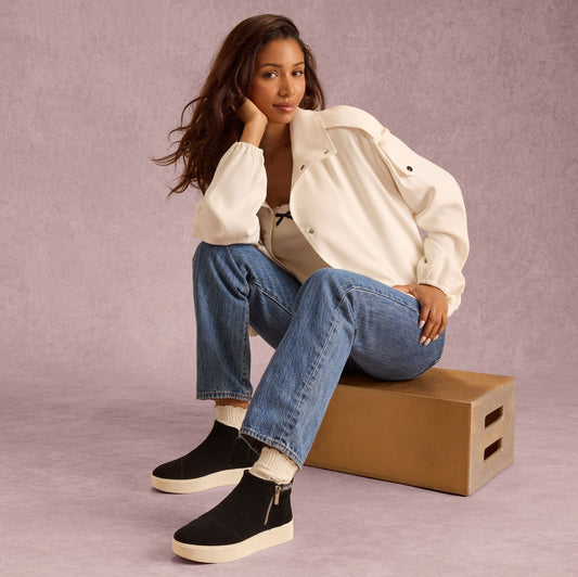 On model image of the Womens Percy Mid Platform Sneaker Water Resistant Black Suede