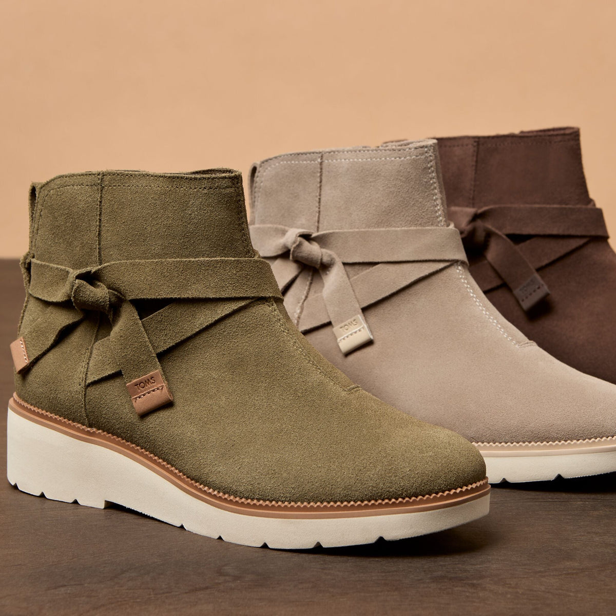 Detail laydown image of the olive Marlow wedge boot